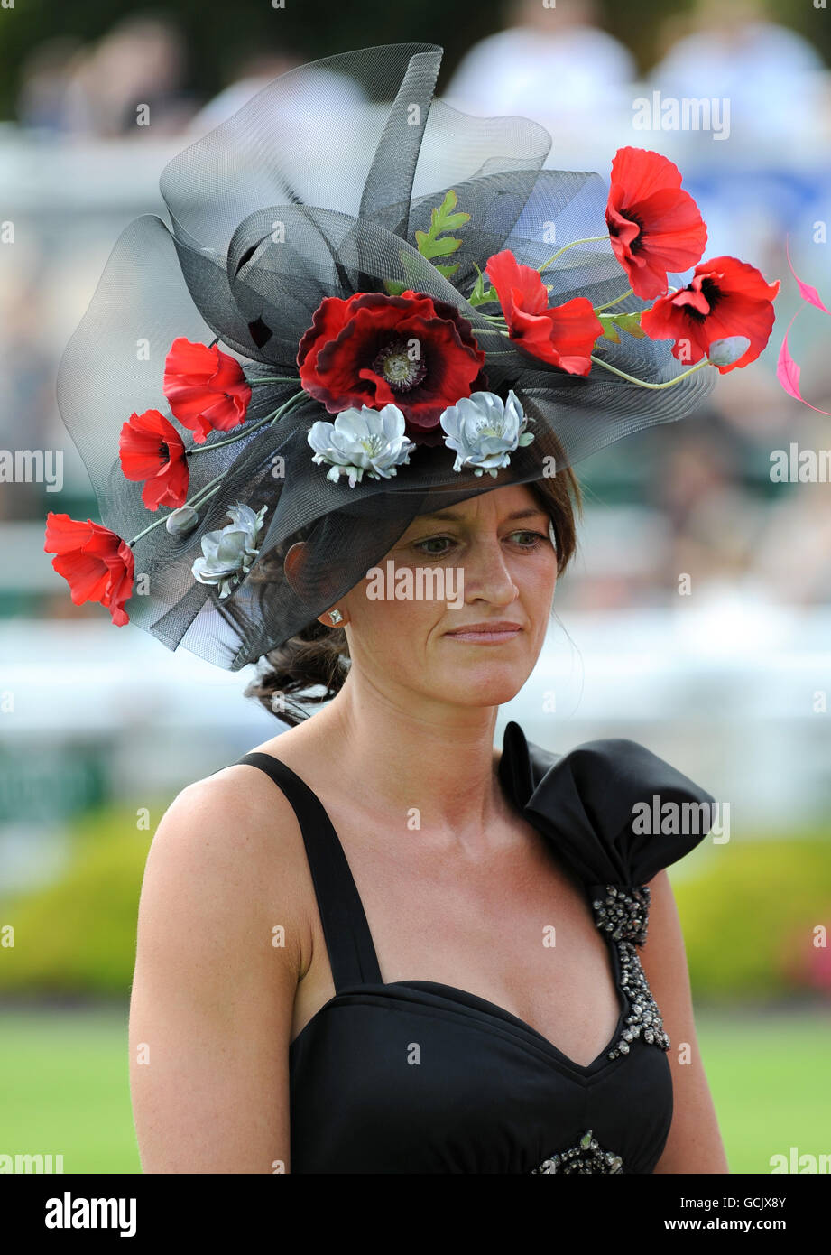 Trish Gould wins the Best Dressed Lady competition during the Coral-Eclipse Day at Sandown Park Stock Photo
