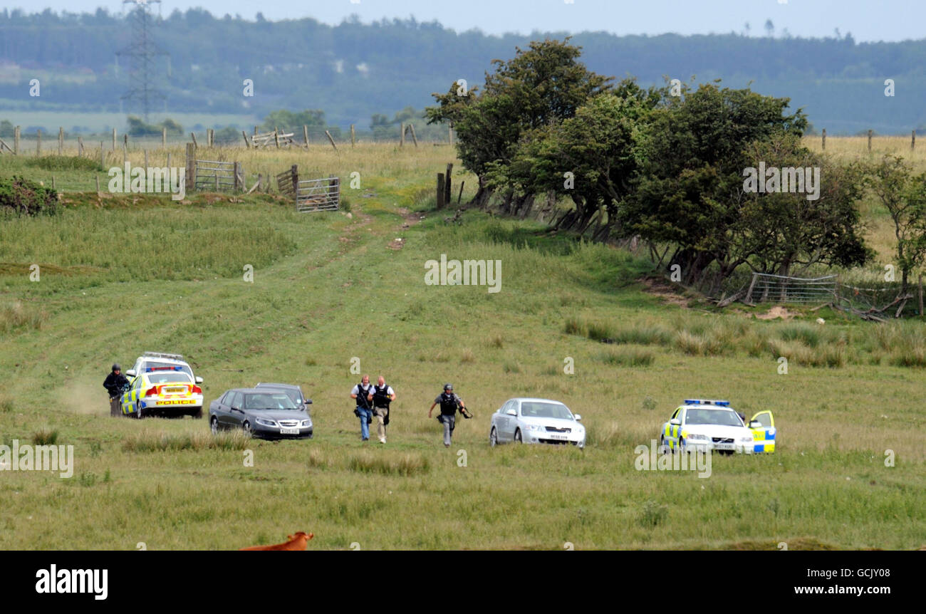 Armed police seen in field in rothbury hires stock photography and