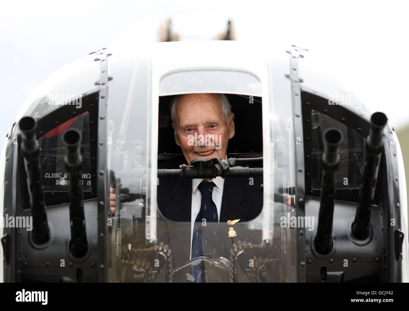 Rear Air Gunner Jim McGillivay, 86, from Essex, sits in the rear gun compartment of the Lancaster bomber, City of Lincoln. Air Gunner McGillivay, attended a reunion of Lancaster Bomber crew at RAF Coningsby, Lincolnshire. Stock Photo