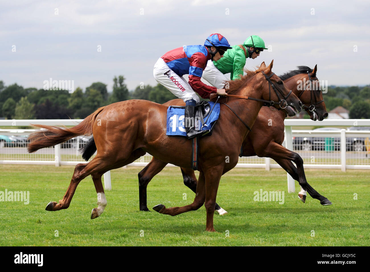 Horse Racing - Eclipse Meeting - Sandown Park. Star Surprise ridden by Jamie Spencer (left) and Control Chief ridden by Jim Crowley (right) go to post. Stock Photo