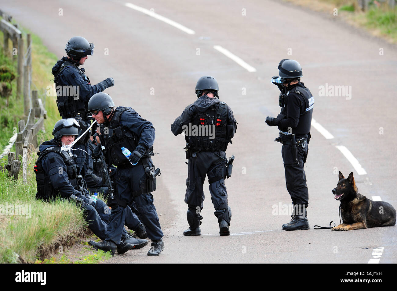 Arrmed police officers in the countryside outside Rothbury, Northumberland, during the search for gunman Raoul Moat. PRESS ASSOCIATION Photo. Picture date: Tuesday July 6, 2010. The 'net was closing' on gunman Raoul Moat today after police detained two men they had feared he was holding hostage. See PA story POLICE Shootings. Photo credit should read: Owen Humphreys/PA Wire Stock Photo