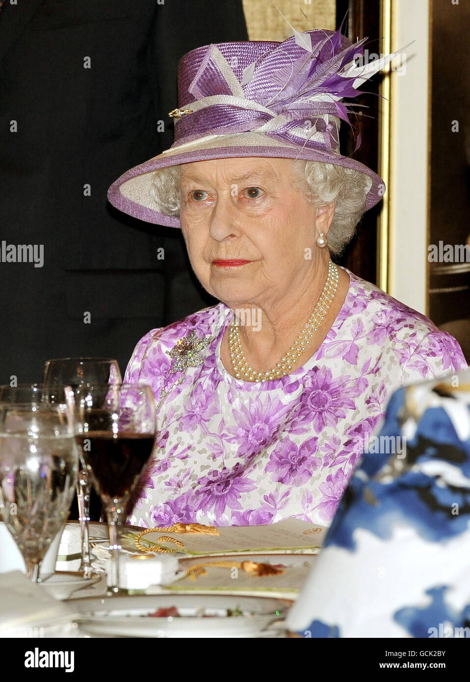 Britain's Queen Elizabeth II sits at her table for lunch during a visit