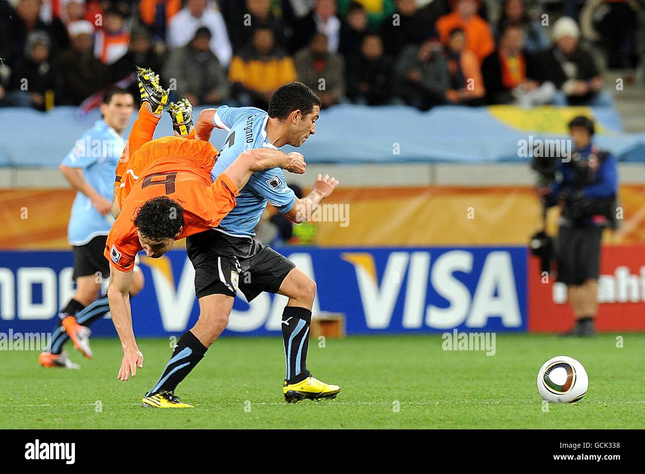 Uruguay's Walter Gargano and Netherlands' Mark Van Bommel battle for the ball Stock Photo