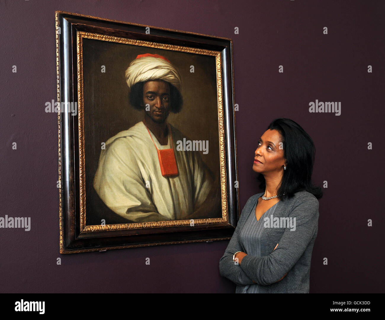 Broadcaster and National Portrait Gallery Trustee, Zeinab Badawi, with a portrait of Ayuba Suleiman Diallo (c. 1701-73) by William Hoare at the gallery, where an appeal was launched to purchase it from a private collection in order to save it for the nation for an additional 100,000. The richly historic portrait would be the first known British oil painting of a freed slave. Stock Photo