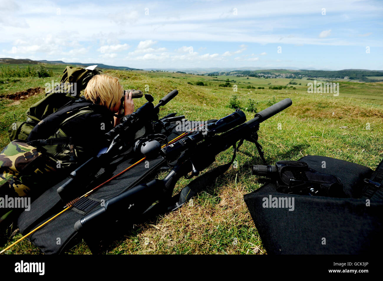 A police sniper is seen in the area surrounding the village of Rothbury, Northumberland, as the manhunt for fugitive gunman Raoul Moat continues. Stock Photo