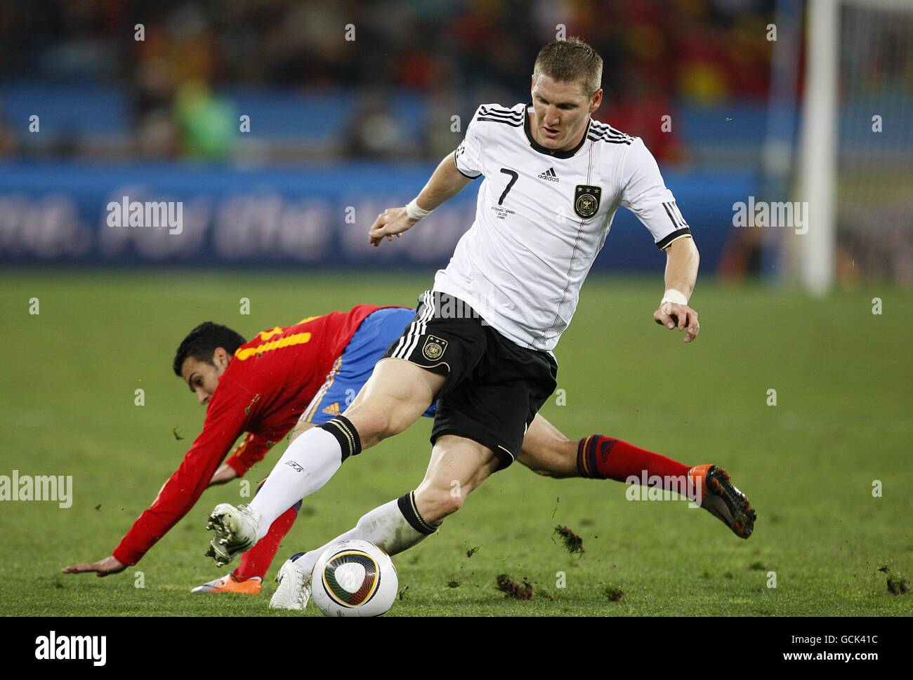 Soccer - 2010 FIFA World Cup South Africa - Semi Final - Germany v Spain - Durban Stadium. Germany's Bastian Schweinsteiger (right) and Spain's Rodriguez Pedro (left) battle for the ball Stock Photo