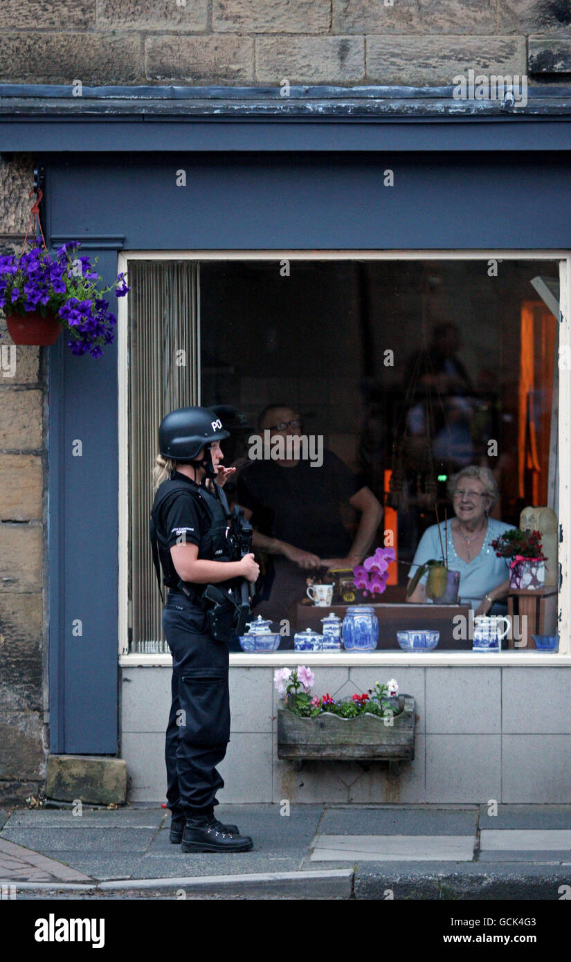 Armed police on the streets of Rothbury, Northumberland as fugitive