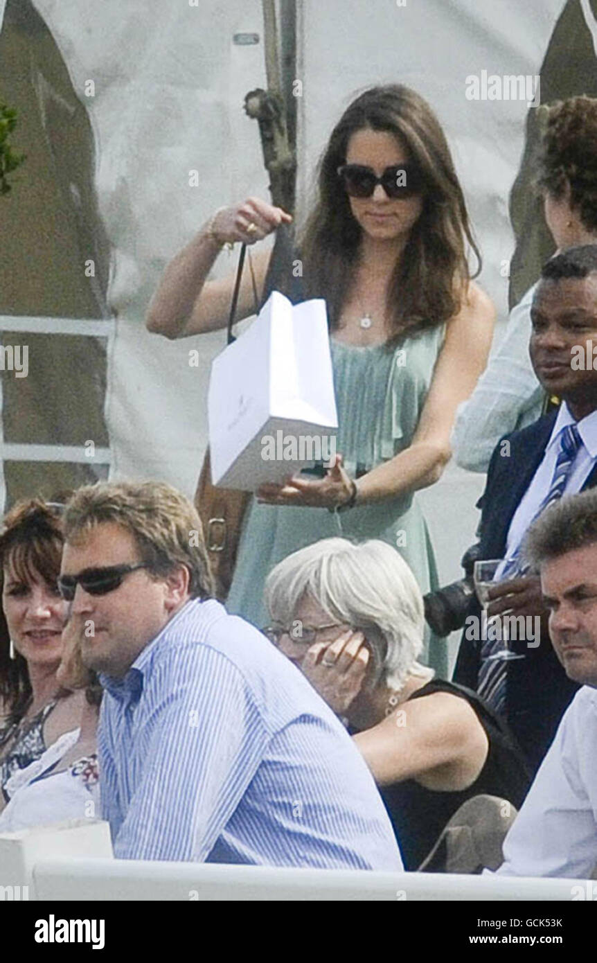 Kate Middleton (wearing a green dress) in the crowd at the Chakravarty Cup  polo match at Beaufort Polo Club near Tetbury Gloucestershire where her  boyfriend William is playing in the charity match