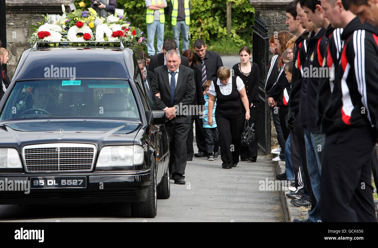 Seamus mcdaid follows carrying the coffin of his son mcdaid hi-res ...