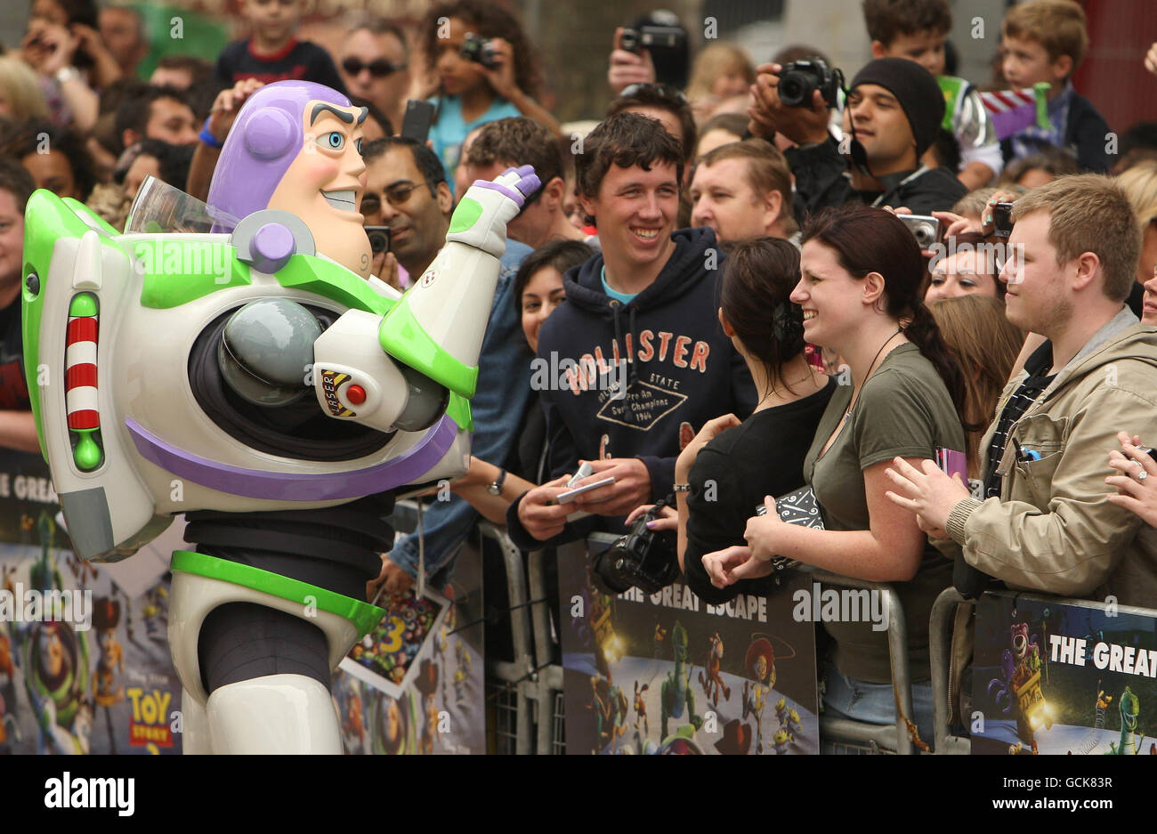 Toy Story character Buzz Lightyear greets fans at the UK Premiere of Toy Story 3 in Leicester Square, central London. Stock Photo