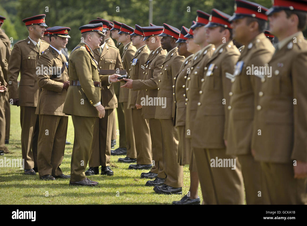 General Sir Timothy Granville-Chapman GBE KCB hands out Operation Herrick medals for service in Afghanistan, to soldiers from the 1st Regiment Royal Horse Artillery parade, at Tattoo Parade Ground, Tedworth Park, Tidworth. Stock Photo