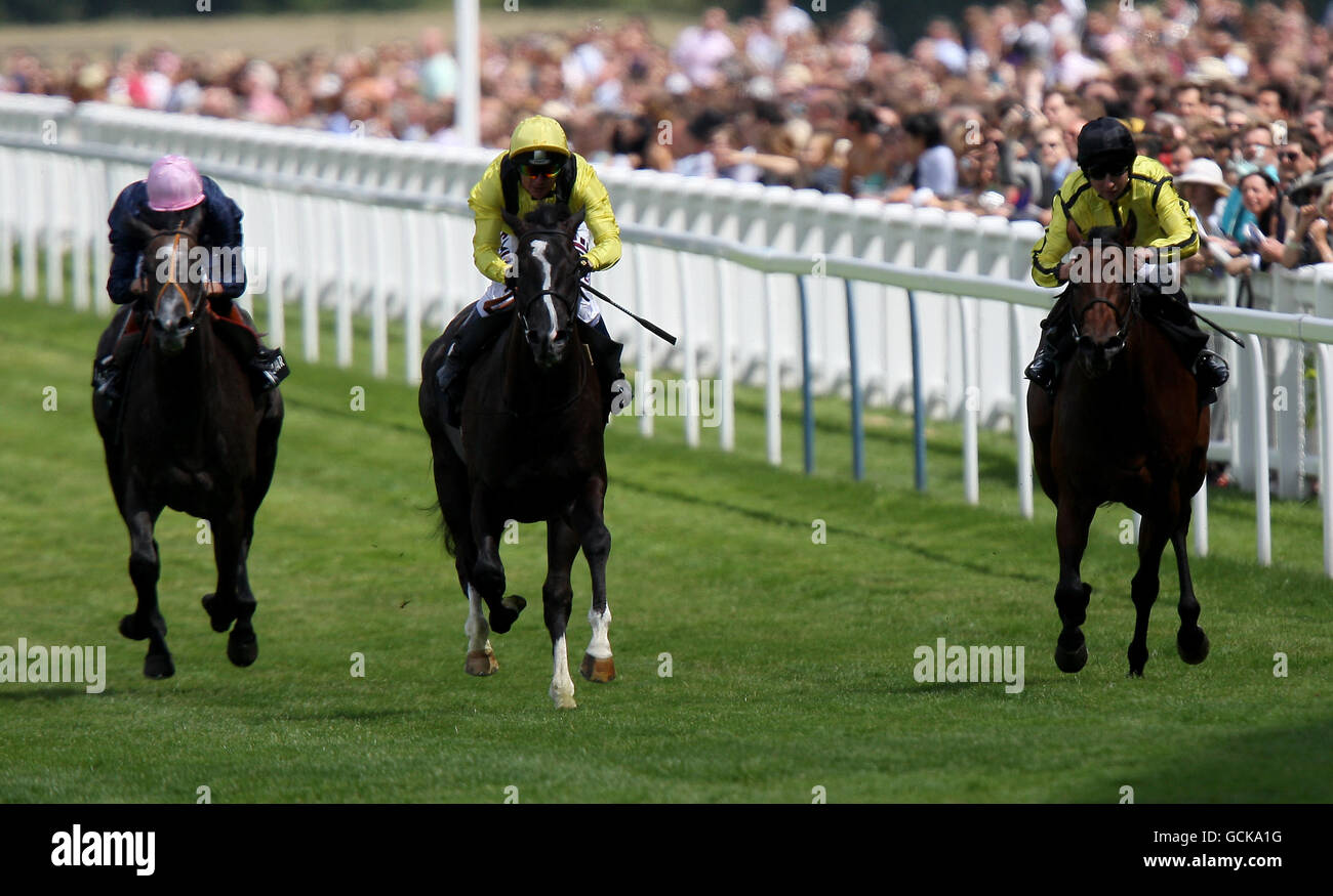 Horse Racing - Betfair Weekend King George Day - Ascot Racecourse. Toolain (yellow cap) ridden by Philip Robinson comes home to win The Jaguar XK winkfield stakes Stock Photo