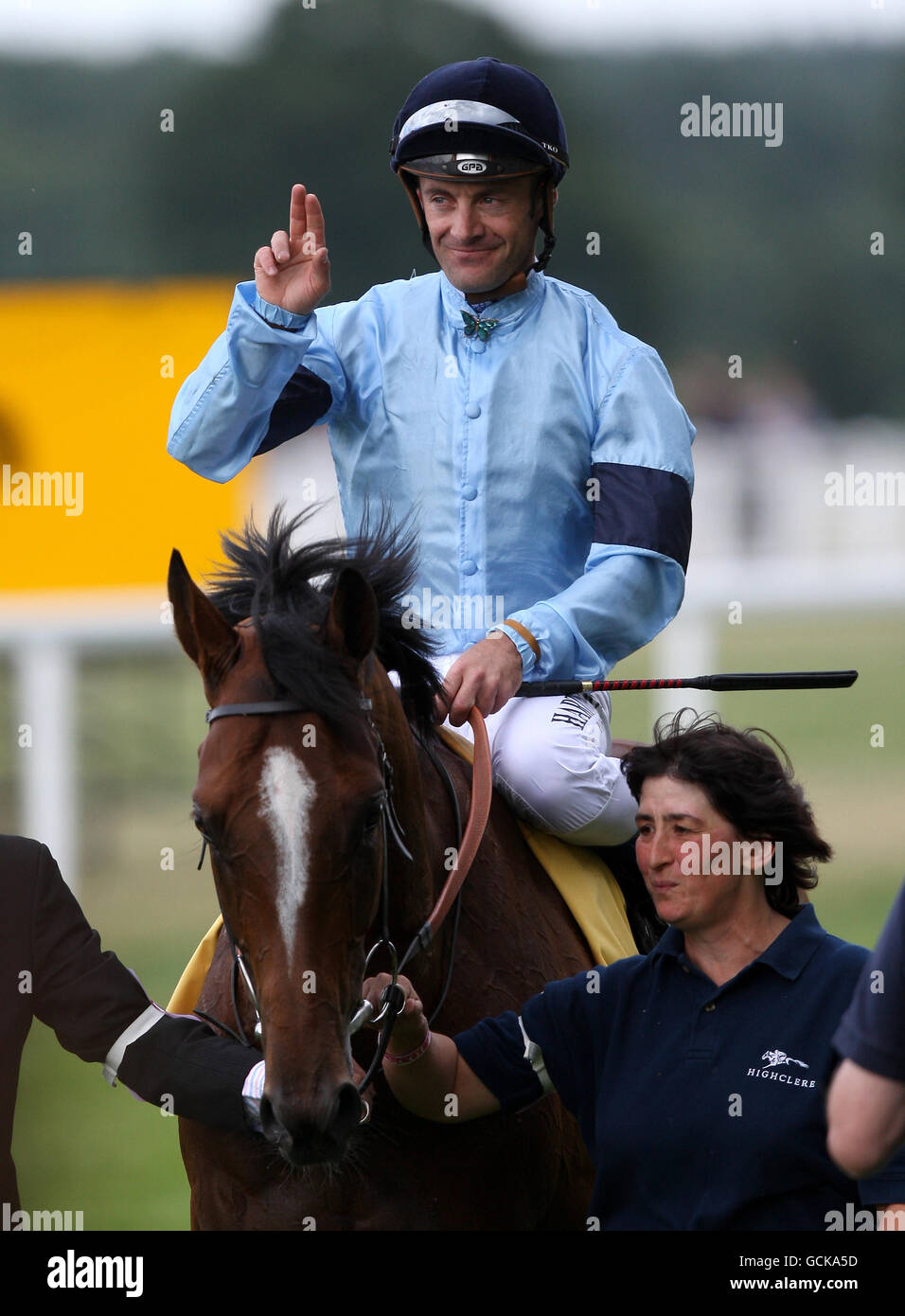 Olivier Peslier celebrates riding Harbinger to victory in The King George VI and Queen Elizabeth stakes Stock Photo