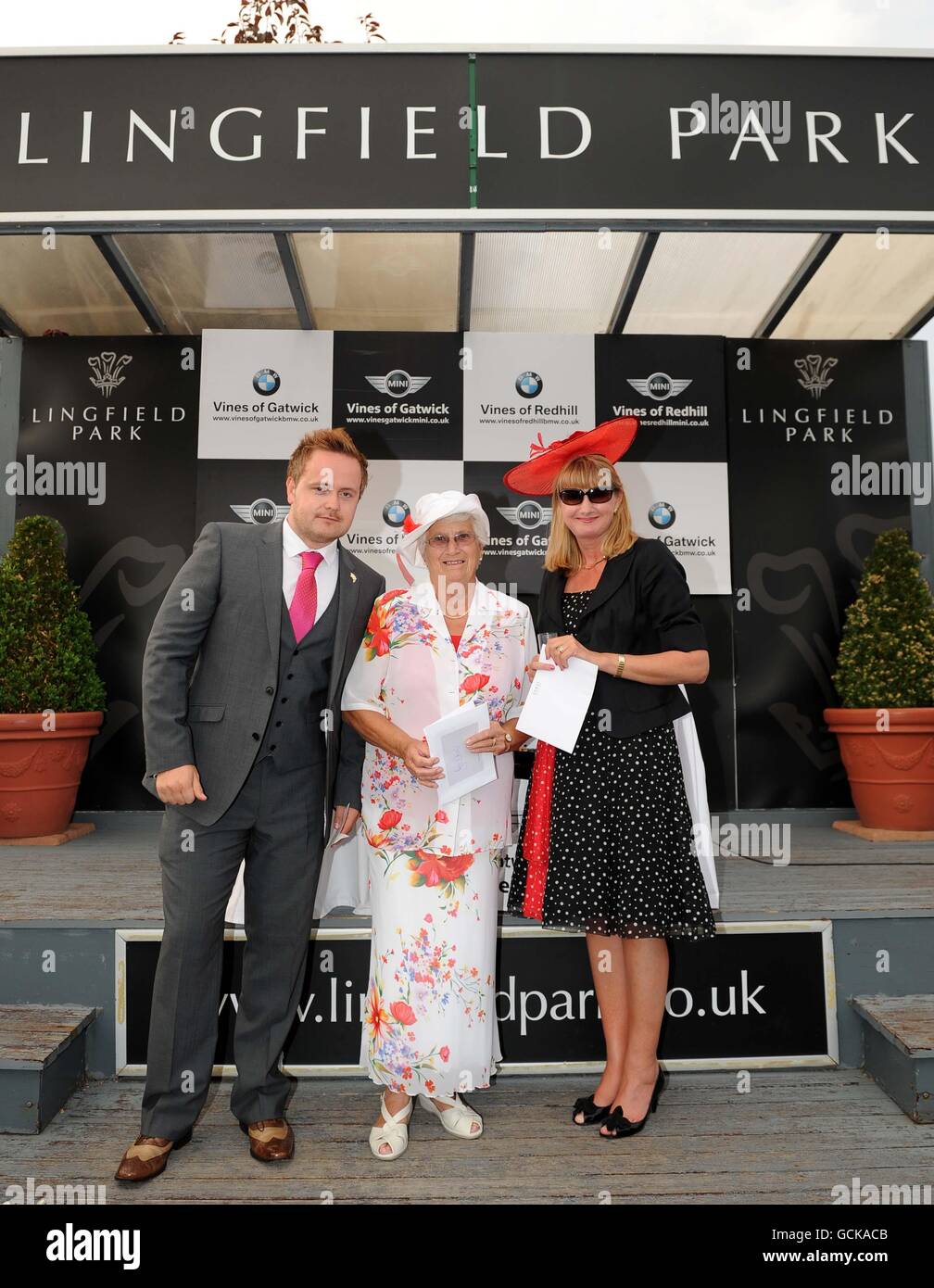 Horse Racing - Vines of Gatwick and Redhill Ladies' Evening - featuring Girls B Loud - Lingfield Park. Winners (left to right) of the best dress male, female and best accessory at Lingfield Races. Stock Photo