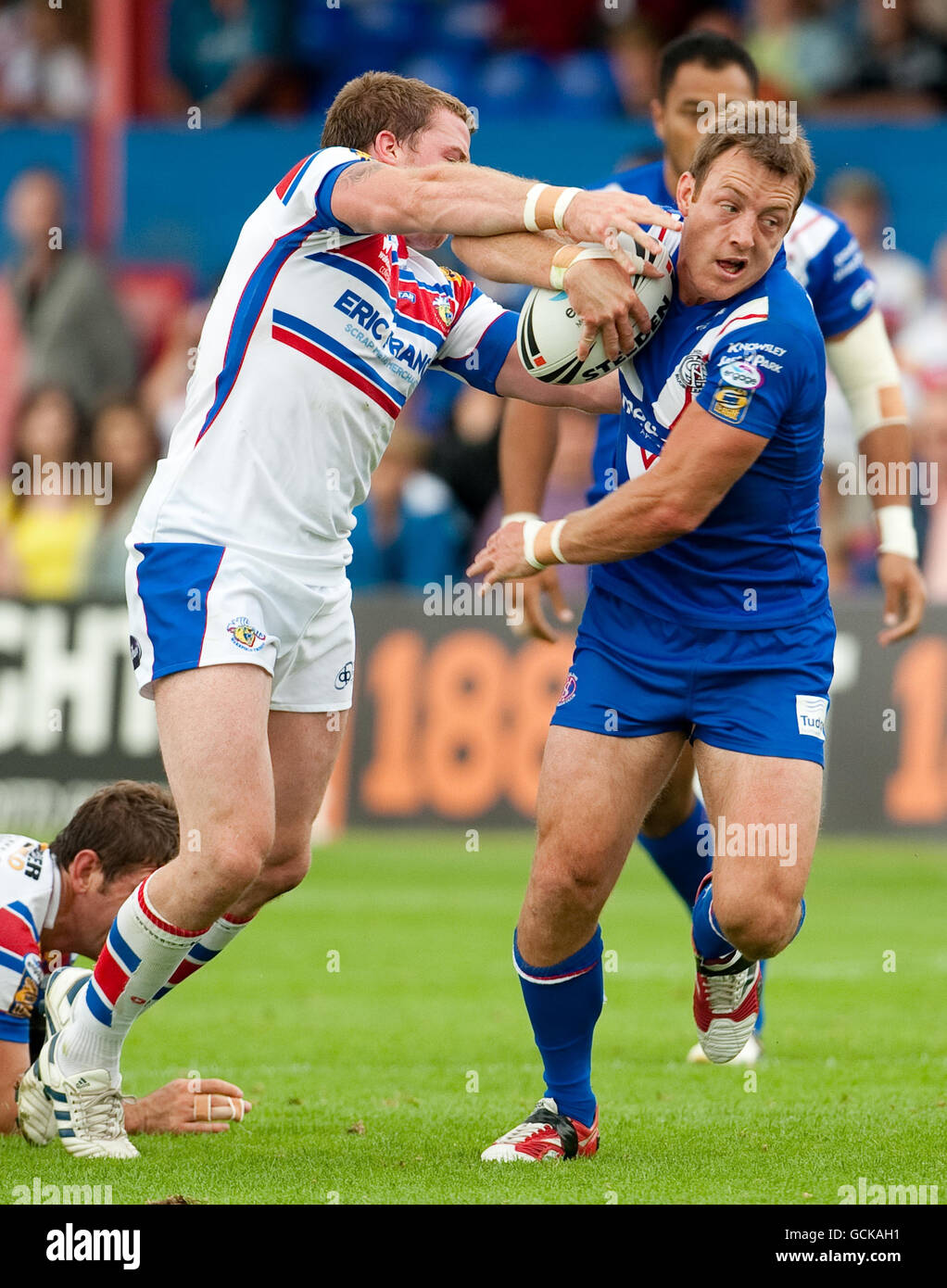 St Helens' James Roby is tackled by Wakefield's Danny Kirmond during the Engage Super League match at the Belle Vue Stadium, Wakefield. Stock Photo