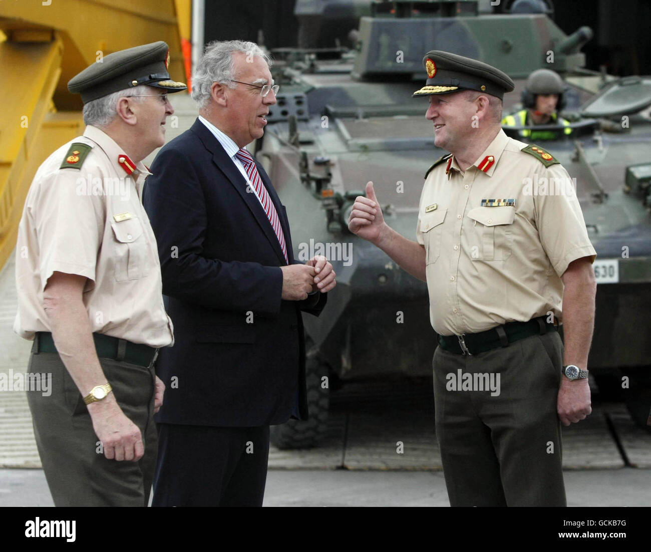 (from left) Assistant Chief of Staff Dave Ash, Defence Minister Tony Killeen and Defence Forces Chief of Staff Lieutenant General Sean McCann oversee MOWAG Armoured Personnel Carriers being unloaded from the MV Grande Senegal, into Dublin Port as the Defence Forces equipment is returned from their recent UN Mission in Chad. Stock Photo