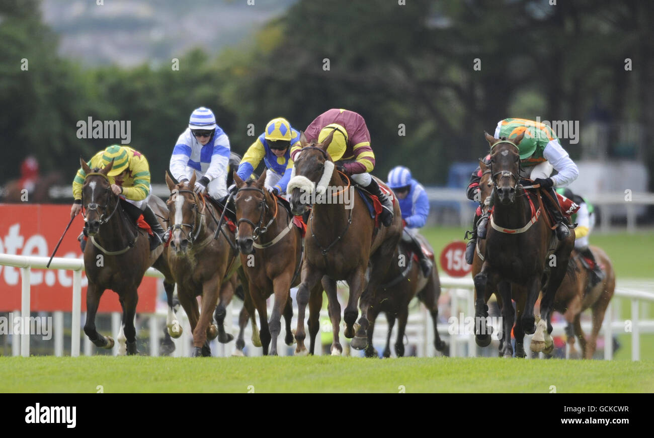 Hoopy ridden by Paul Carberry (second right) goes on to win the Tote Jackpot  Races 3 to 6 Handicap Hurdle on day three of the Summer Festival at Galway  Racecourse, Ireland Stock