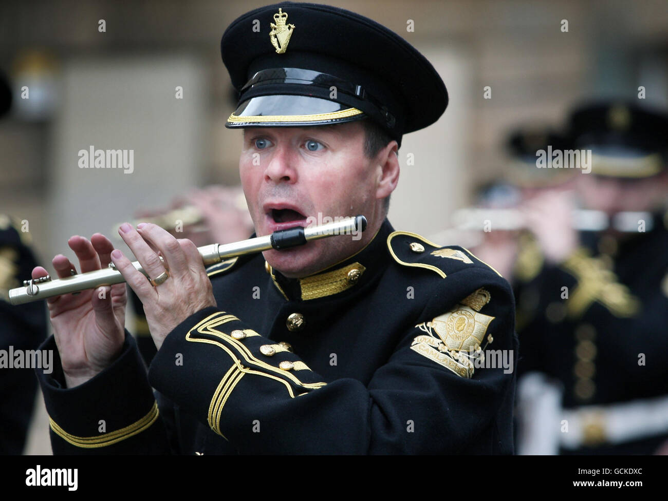 A flute player marches with his band during the Orange Order parade