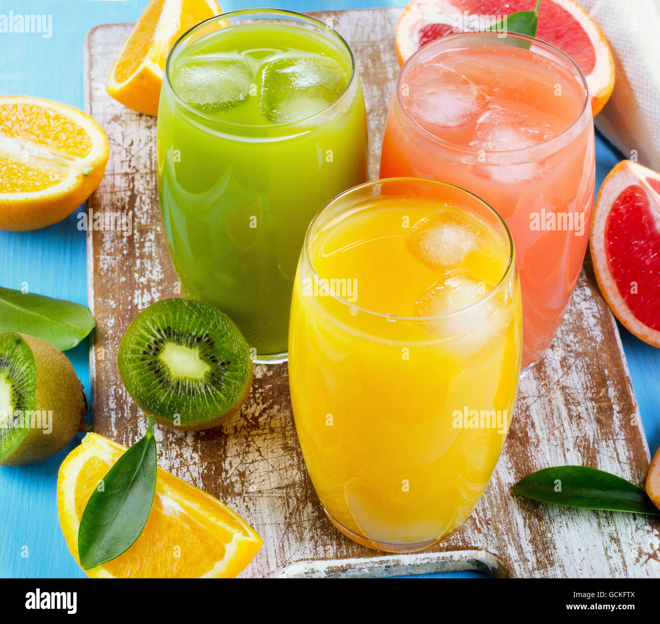 Citrus juice   on a wooden board. Selective focus Stock Photo