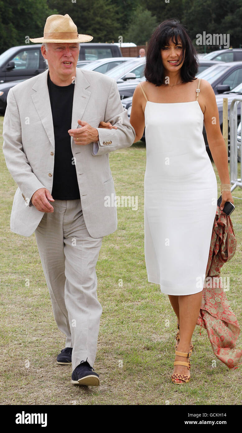 Pink Floyd singer and guitarist David Gilmore arrives with his wife Polly Samson for the Veuve Clicquot British Open Polo Championship at Cowdray Park, Midhurst, West Sussex. Stock Photo