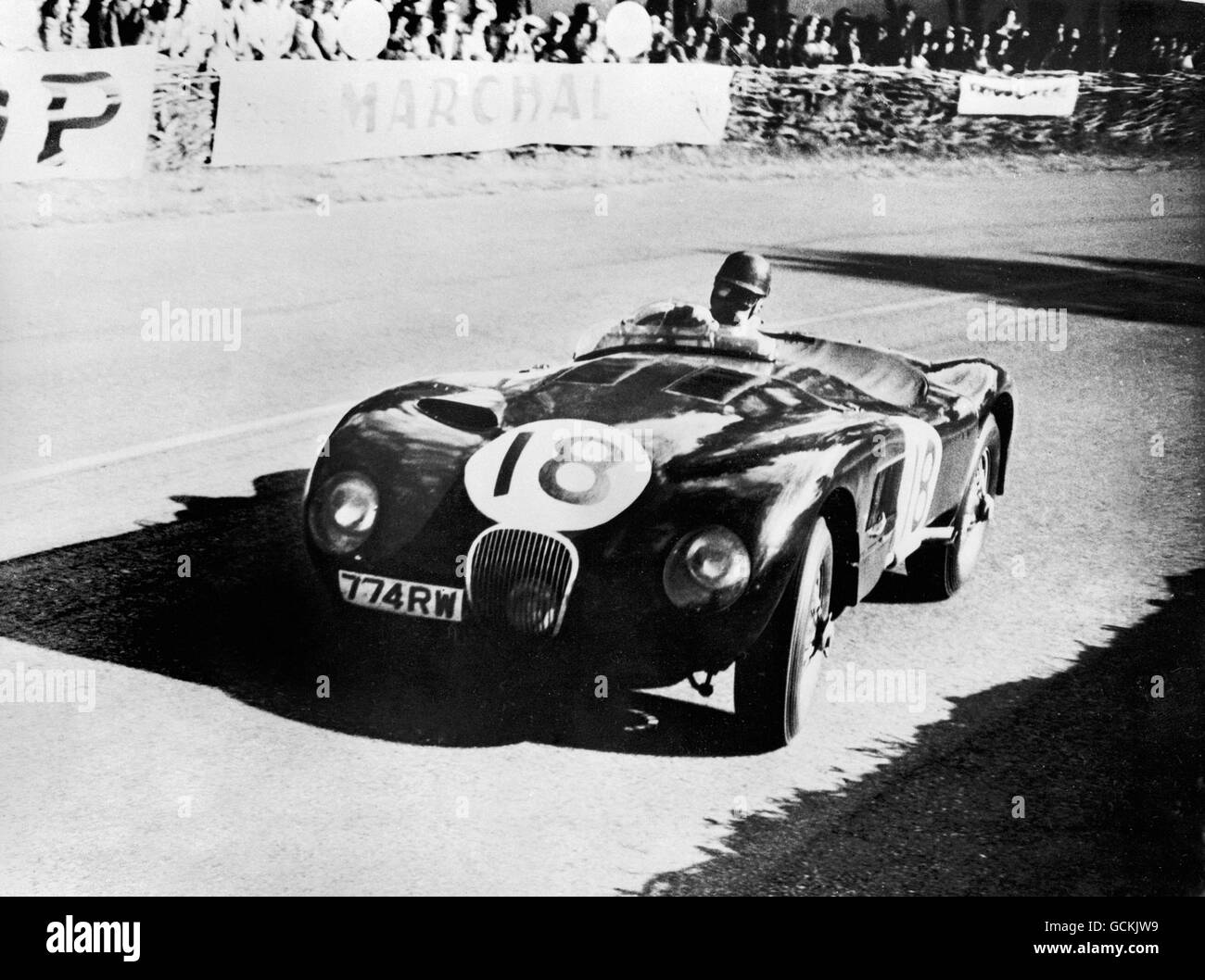 The Jaguar C-Type of Tony Rolt and Duncan Hamilton racing to victory in the 21st running of the Le Mans 24 Hours in France Stock Photo