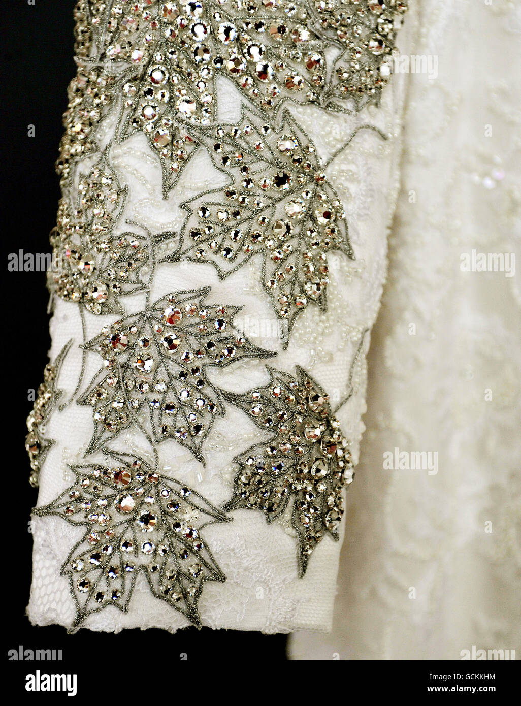 Queen Elizabeth II's recycled white lace gown, with crystal Maple Leaf  emblems, first worn in Trinidad last November and adorned with birds native  to that island, and now adapted for use on