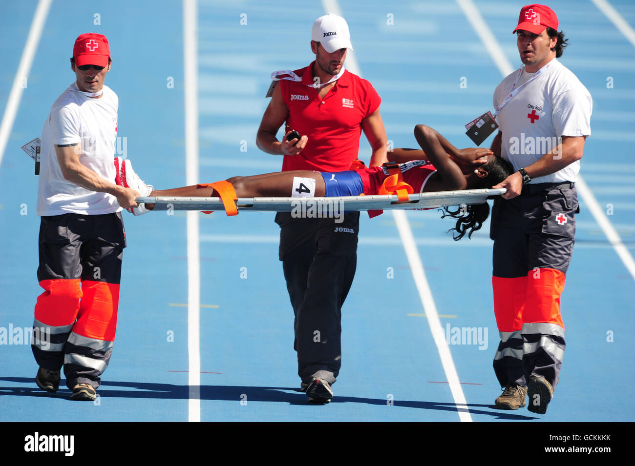 Norway's Folake Akinyemi is stretchered from the racetrack after failing to finish in the women's 100m heats Stock Photo