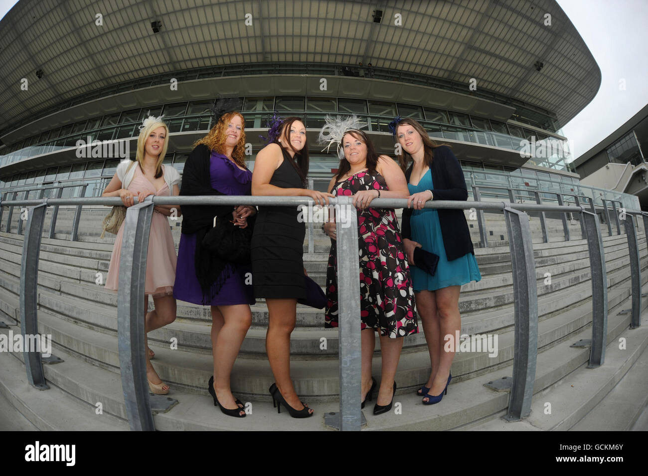 Racegoers (left to right) Shauna Ferry (Donegal), Gobnait Scannell (Cork) Helen Hoare (Cork) and Mary Carey (Cork) and Ciara Brennan (Clare) on day four of the Summer Festival at Galway Racecourse, Ireland. Stock Photo