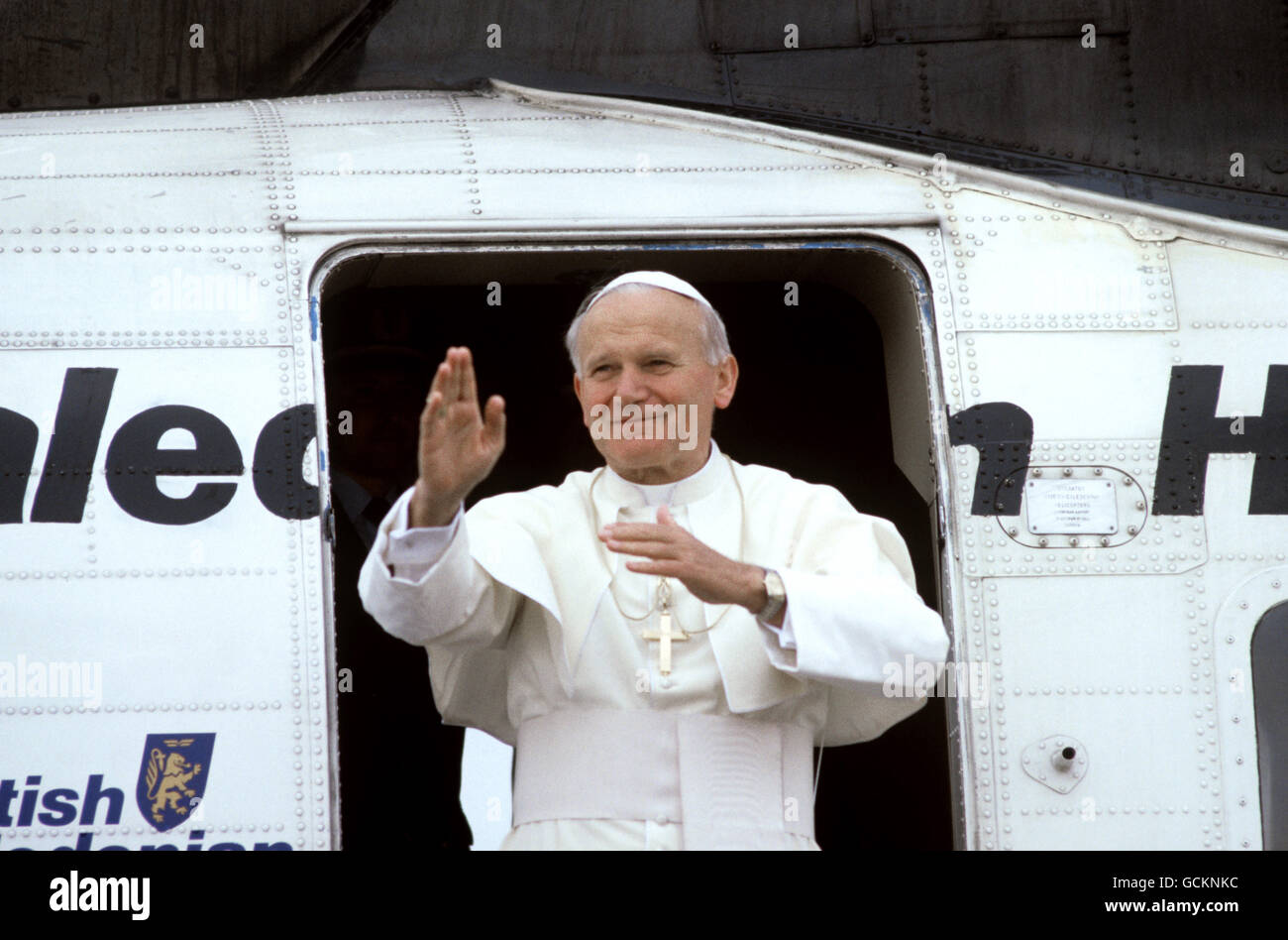 Pope John Paul II gesturing his farewell as he leaves Liverpool's Speke Airport on the fourth day of his historic visit to Britain. Stock Photo