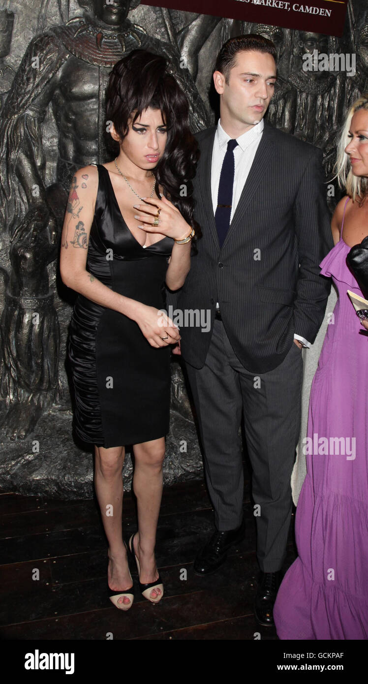 Amy Winehouse and boyfriend Reg Traviss attend the press launch of Shaka Zulu, at Stables Market in Camden, north London. Stock Photo