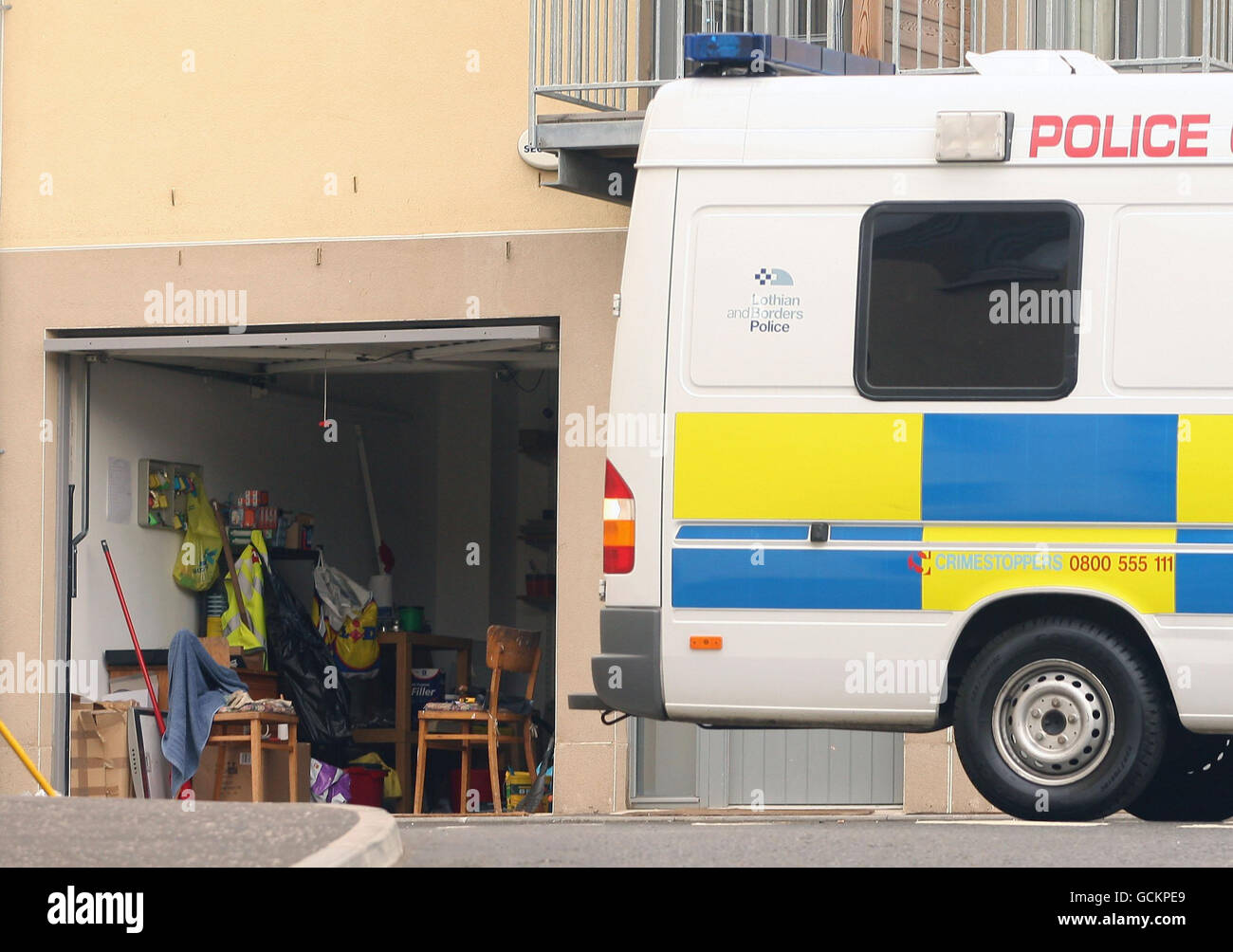 A police van outside buildings on Slateford Road, Edinburgh, after three children were found dead in their home after emergency services were called out to reports of an explosion. Stock Photo
