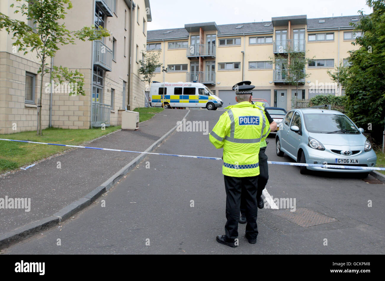 Police outside buildings on Slateford Road, Edinburgh, after three children were found dead in their home after emergency services were called out to reports of an explosion. Stock Photo