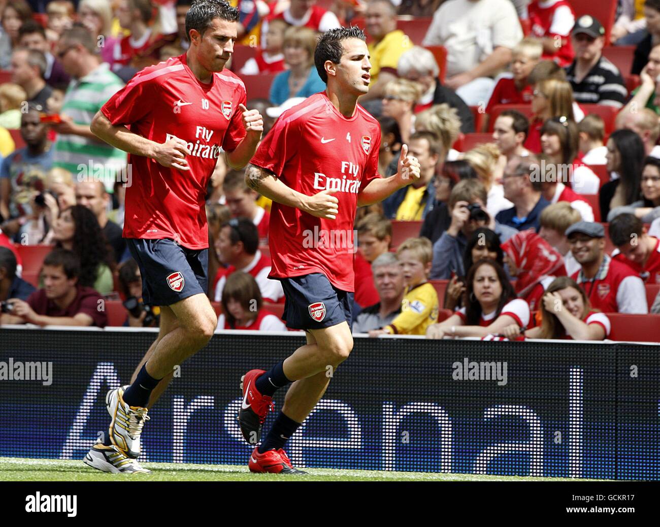 Arsenal's Robin Van Persie (left) and Francesc Fabregas during a training session at the Emirates Stadium Stock Photo