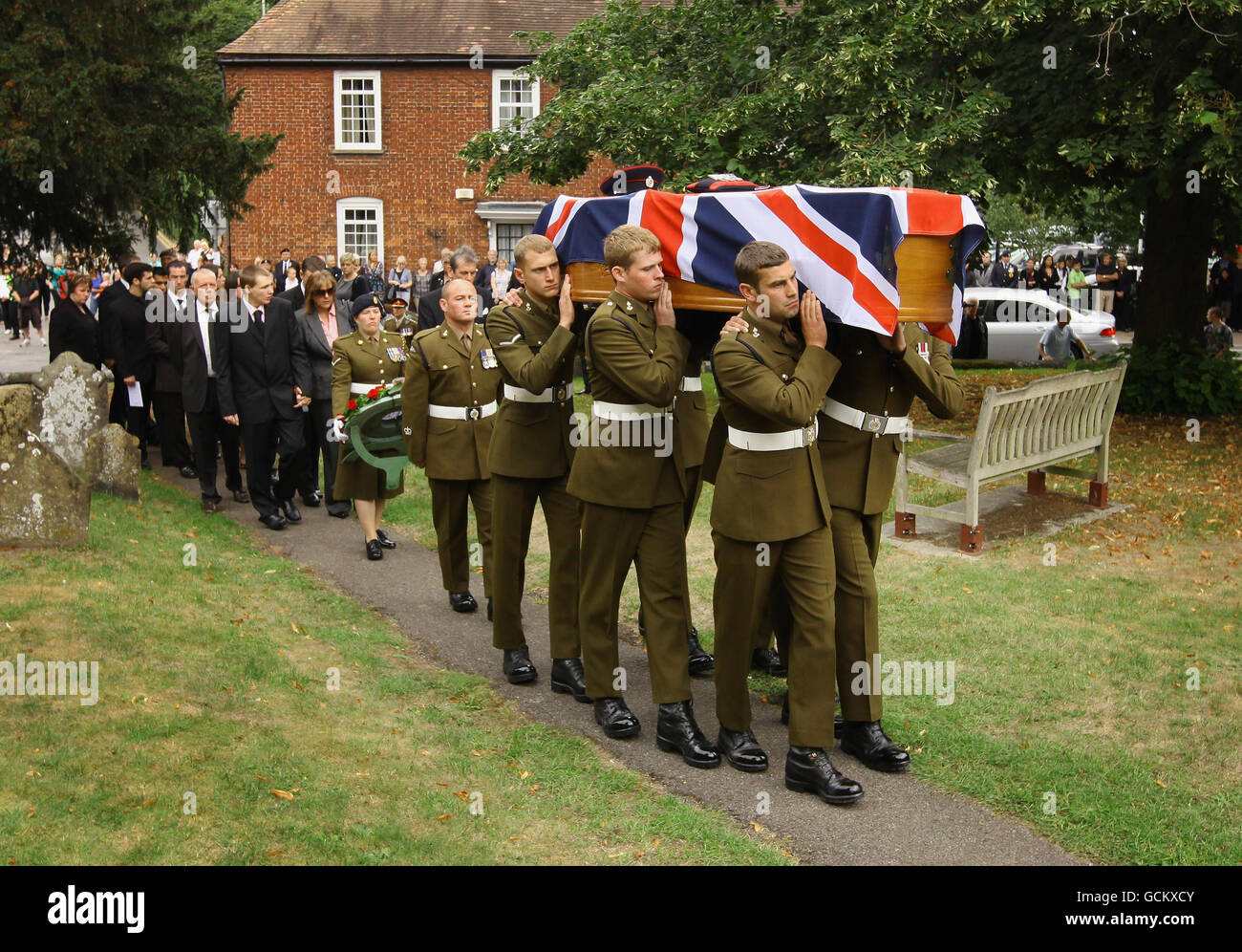 The coffin of Sapper Mark Smith is carried through the churchyard of St ...