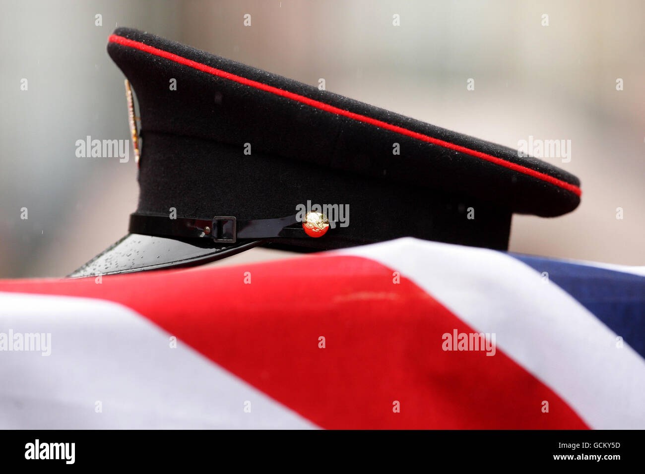 A peaked cap is placed on top of the coffin of Colour Sergeant Martyn Horton as it is carried into St Michael's Church in Runcorn, ahead of a funeral service. Colour Sergeant Horton, 34, was with three other soldiers responding to an attack on a police checkpoint near Gereshk, in Helmand Province, Afghanistan, when the incident happened. Stock Photo