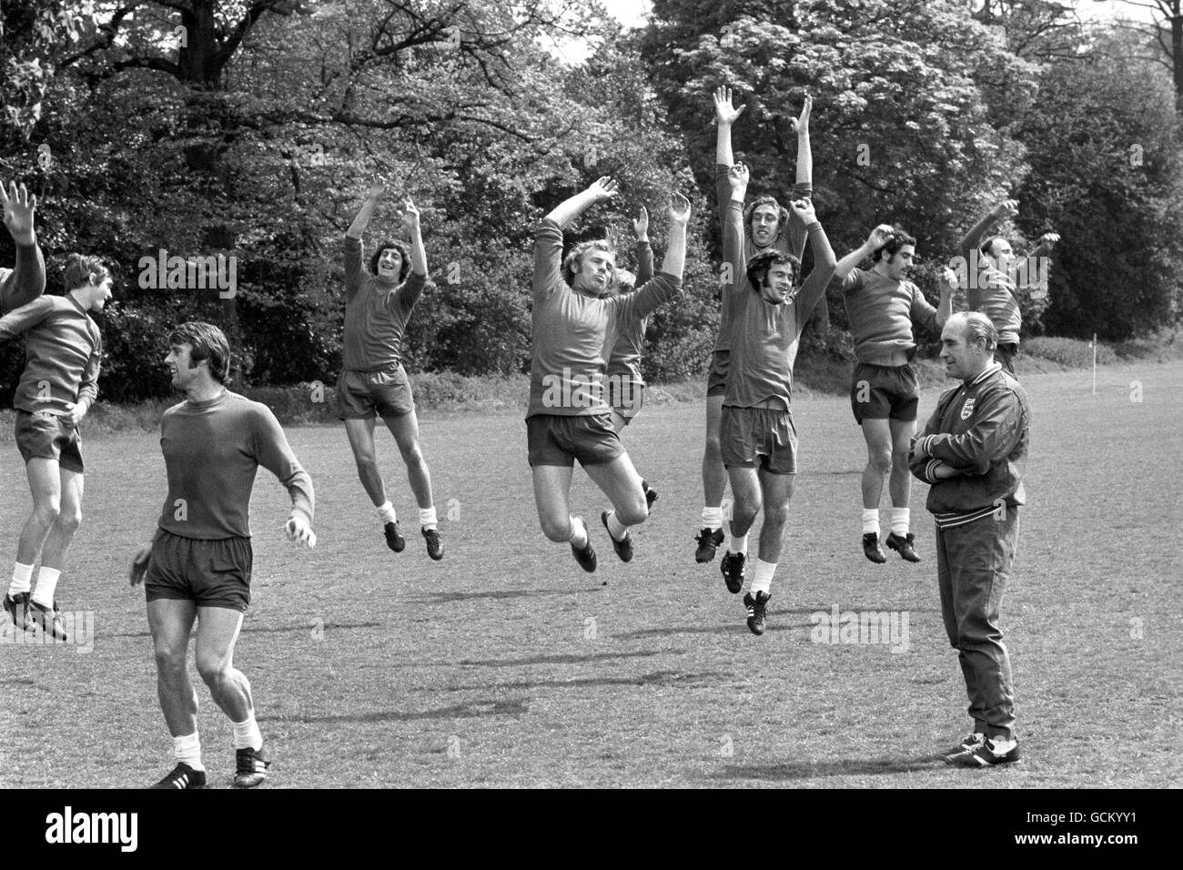 England soccer manager Sir Alf Ramsey (right, foreground) gets his players on the hop at the Bank of England sports ground at Roehampton, where they were training for the European Nations Cup match with Malta. (From l-r) Roy McFarland; Bobby Moore; Martin Chivers; Peter Storey and Peter Shilton. In right background is former England right-back George Cohen, who was training with the squad. Stock Photo