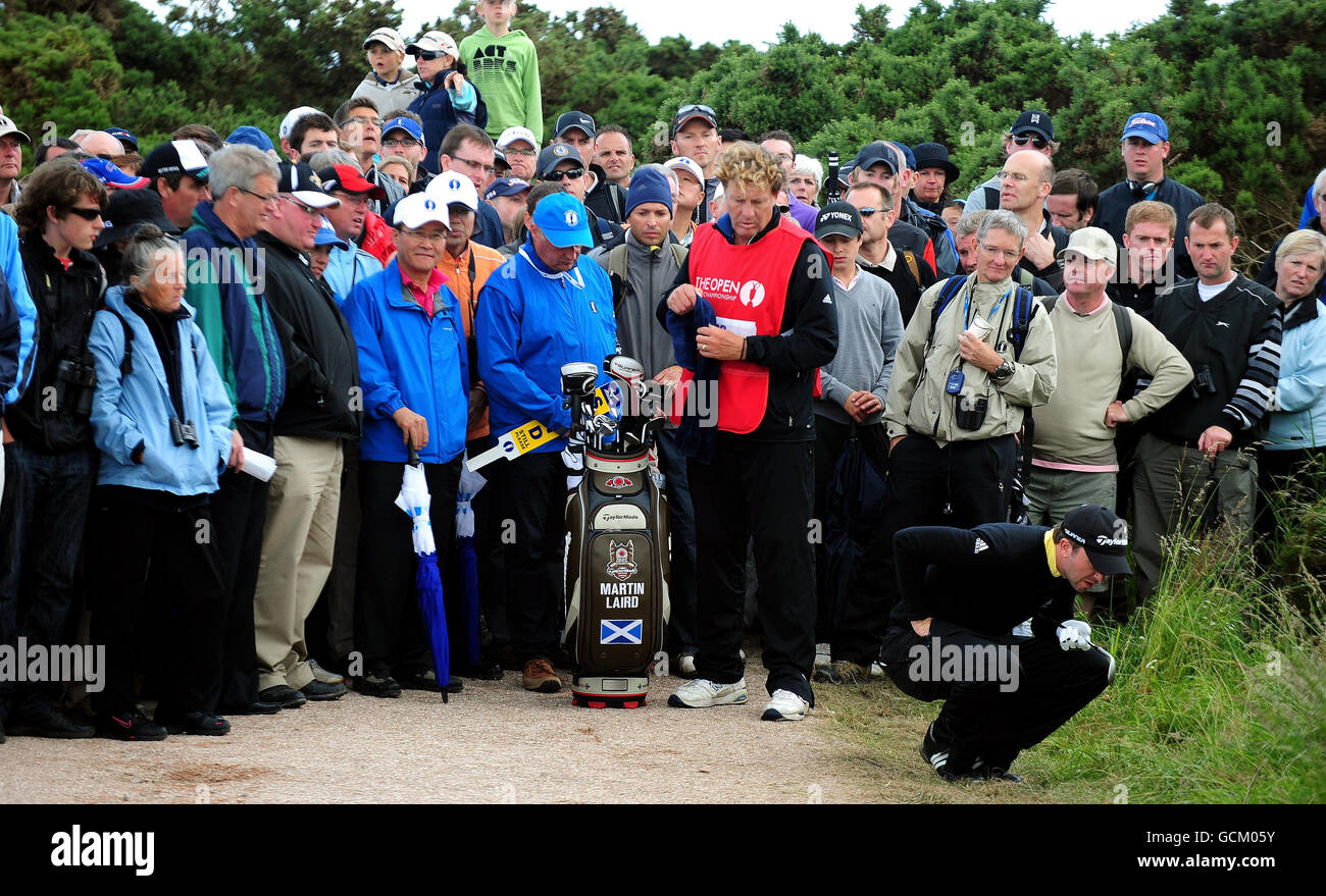 Scotland's Martin Laird inspects his lie during round two of The Open