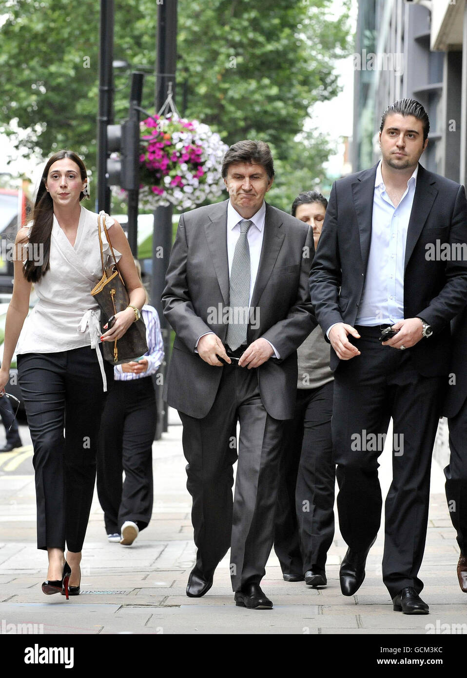 Former Bosnian leader Ejup Ganic (centre) arrives at Westminster Magistrates' Court accompanied by his daughter Emina and son Emir, where a judge is to decide whether to extradite him to Serbia over alleged war crimes. Stock Photo