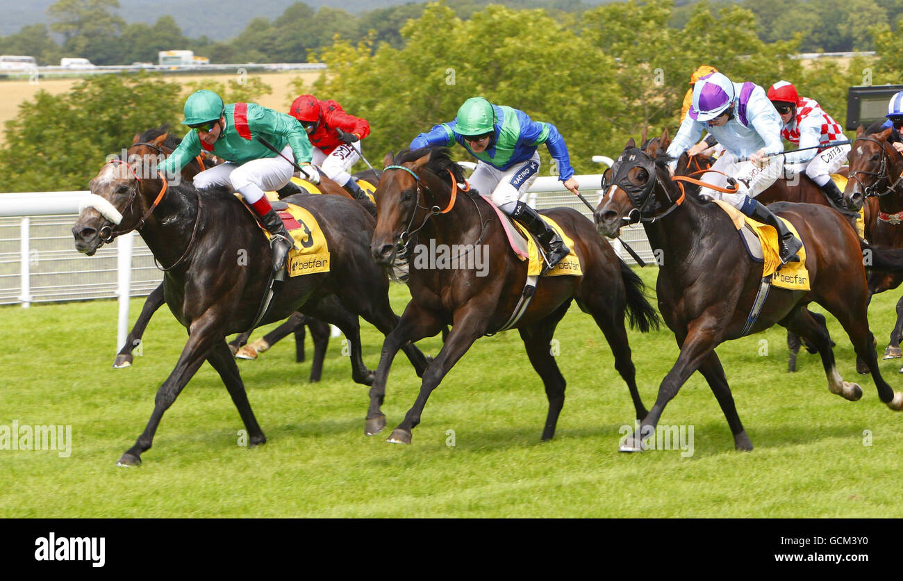 Tom Queally steers Lord Shanakill (blue silks with green cap) through ...