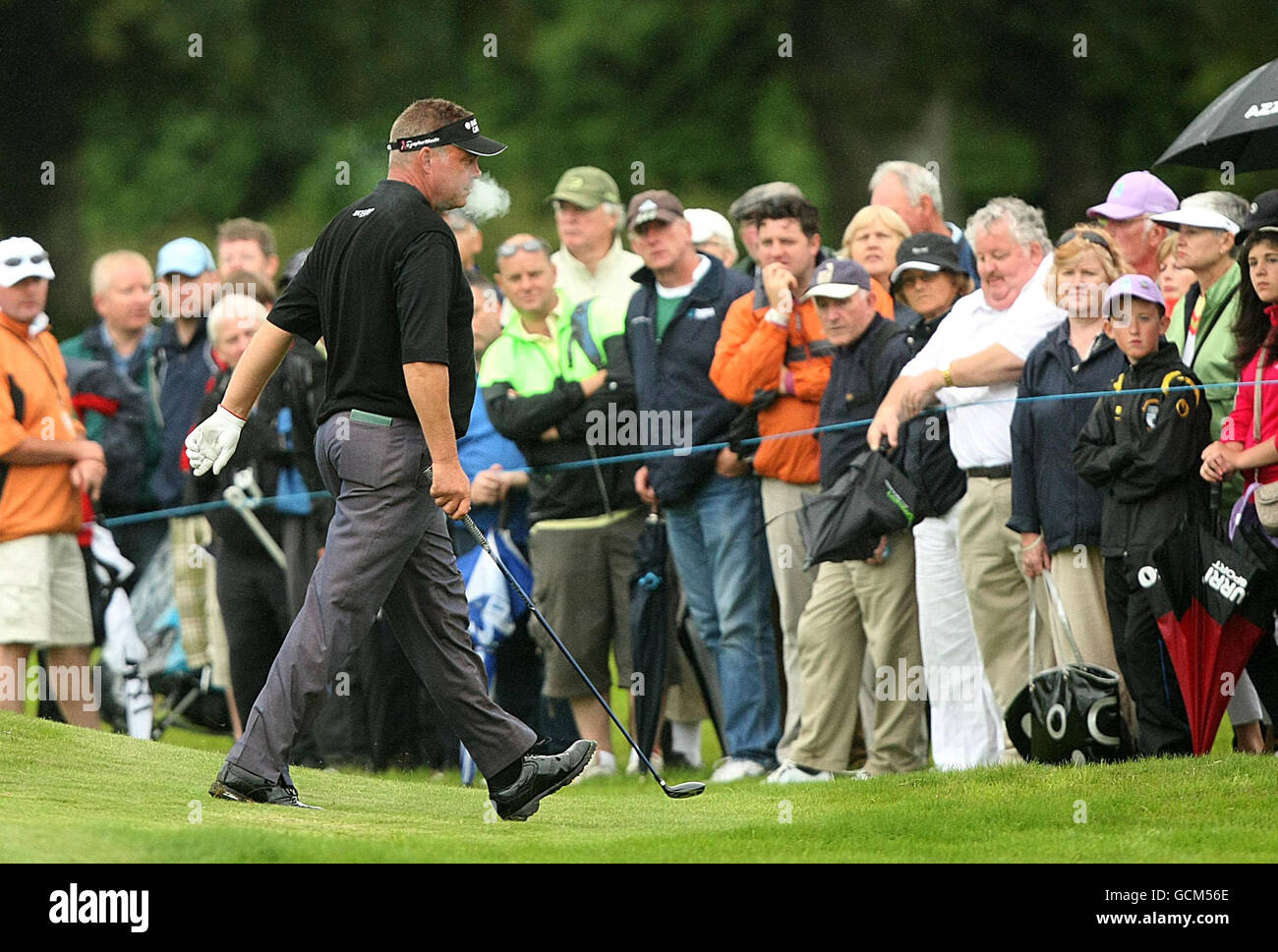 Northern Ireland's Darren Clarke exhaling smoke from a cigarette during