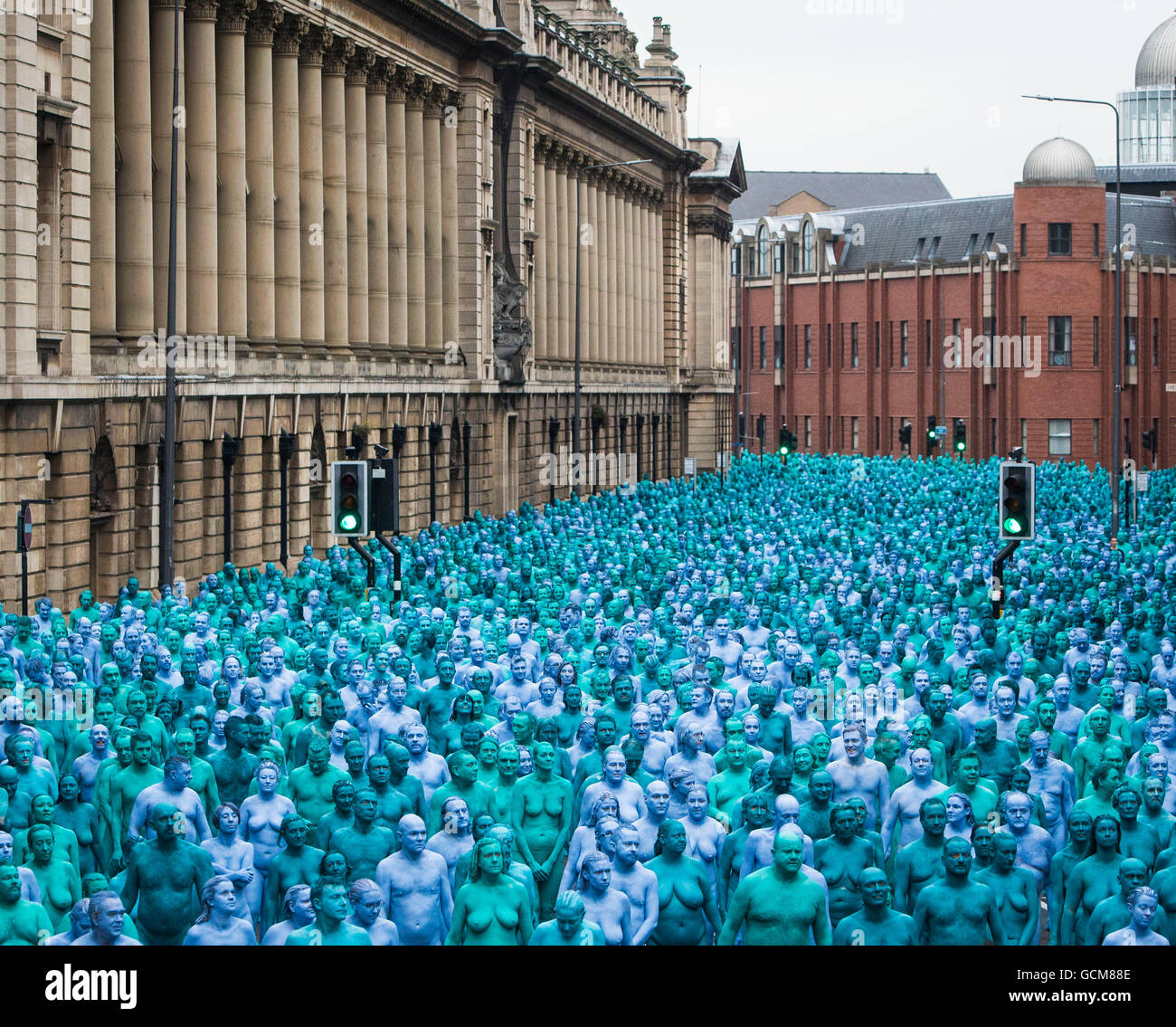 People take part in an installation titled Sea of Hull by artist Spencer Tunick in Hull. Stock Photo