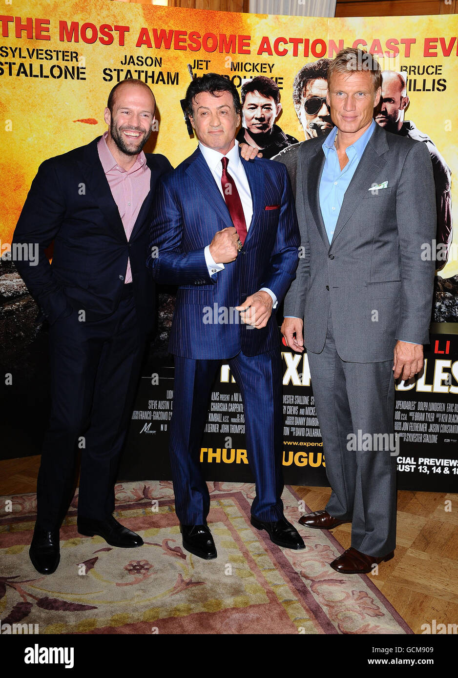 Jason Statham (left), Sylvester Stallone (centre) and Dolph Lundgren arrive at a photocall for new film The Expendables at the Dorchester in London. Stock Photo