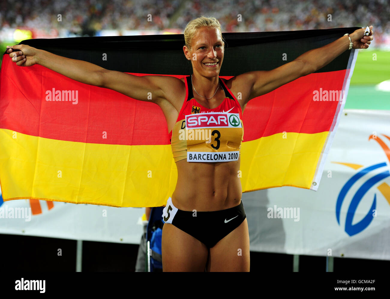 Athletics - IAAF European Championships 2010 - Day Five - Olympic Stadium. Germany's Jennifer Oeser celebrates after winning the bronze medal during the Women's heptathlon Stock Photo