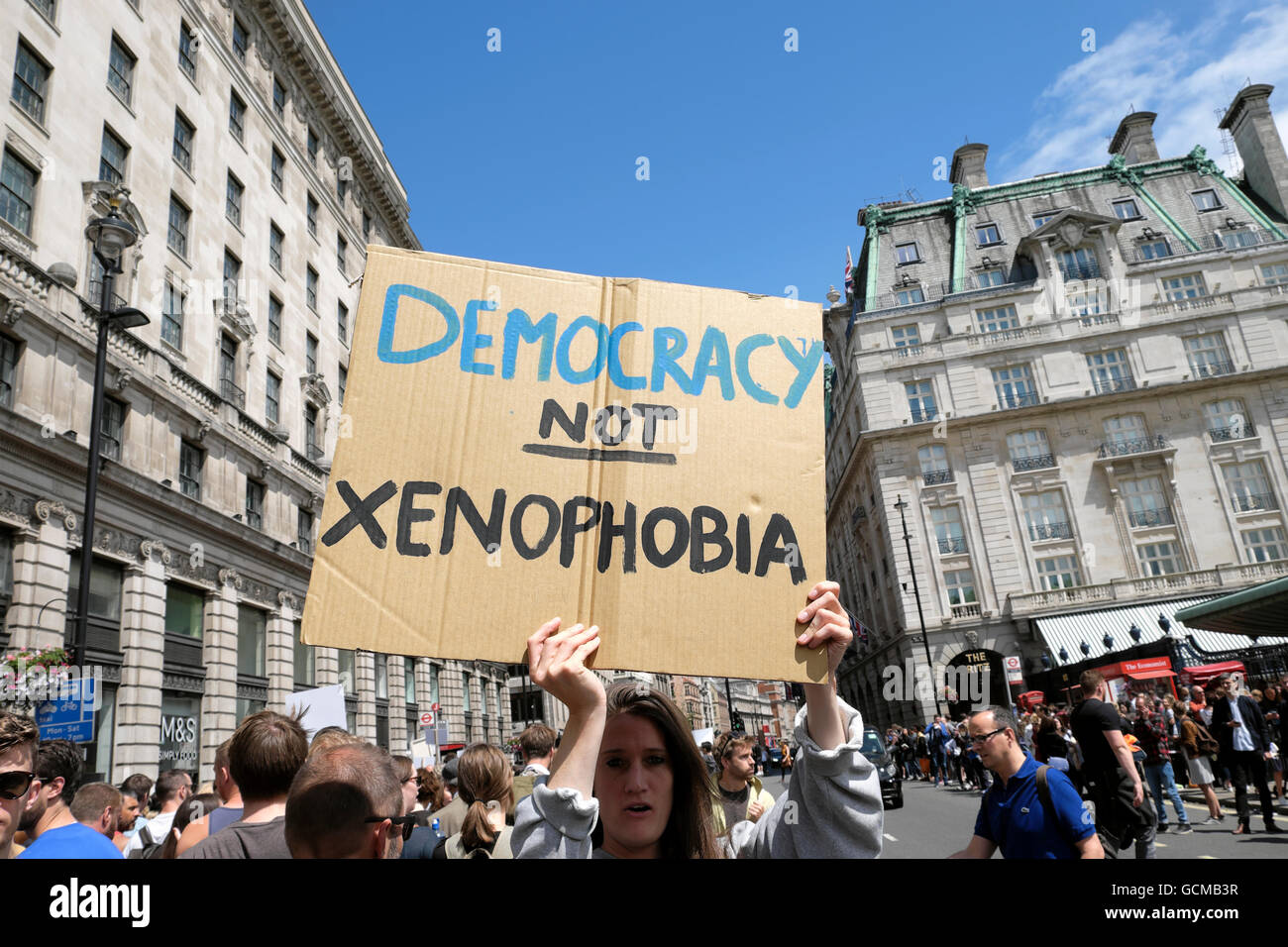 Democracy Not Xenophobia placard and protestors at the Anti Brexit demo 'March for Europe' on 2nd July 2016 Central London England  KATHY DEWITT Stock Photo