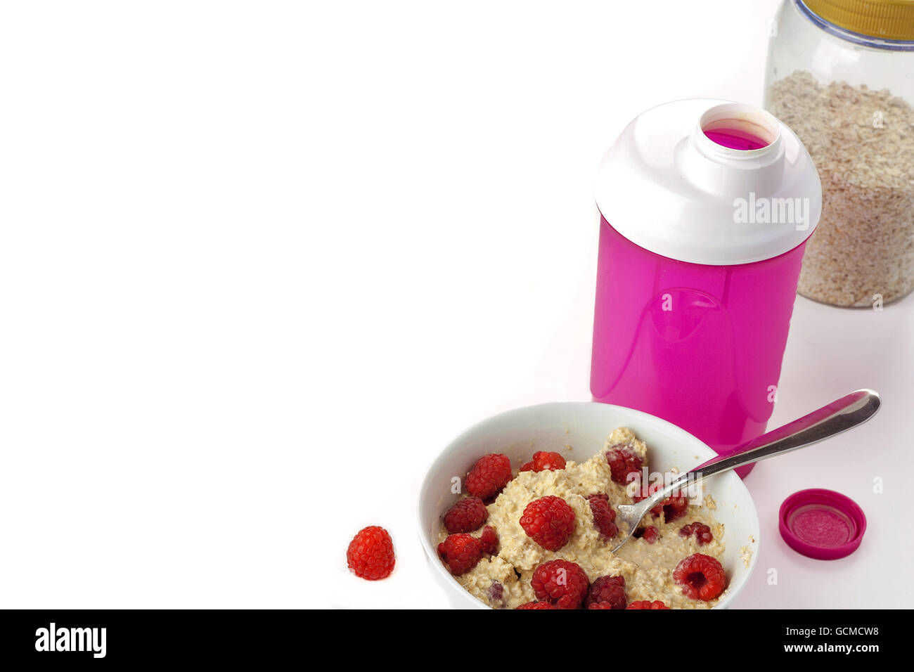 Healthy breakfast. Oat flakes with protein shake and fresh raspberries Stock Photo