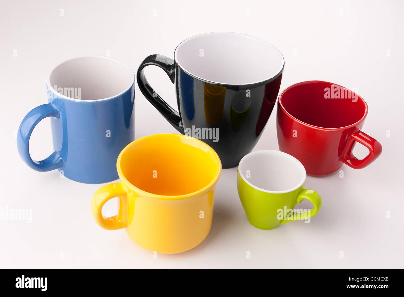 Five assorted color cups in the color of the summer games Stock Photo