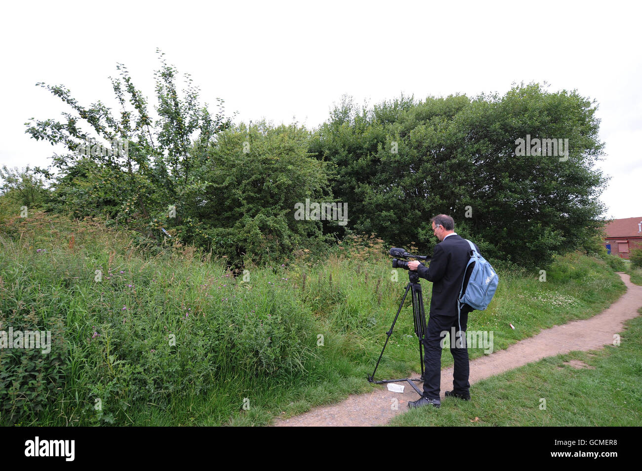A video journalist at the scene close to the Brockwell Medical Centre, in Cramlington, Northumberland, where two men aged 19 and 20 were found hanged. Stock Photo