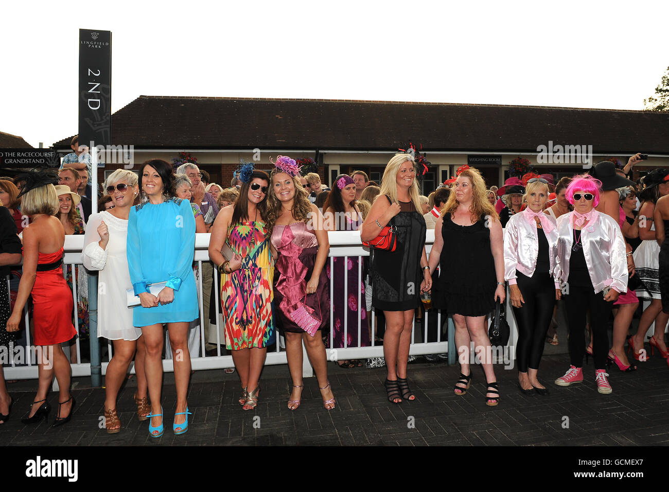 Horse Racing - Vines of Gatwick and Redhill Ladies' Evening - featuring Girls B Loud - Lingfield Park. Ladies gather in the winners enclosure for the judging of the 'Best Dressed Lady' competition. Stock Photo