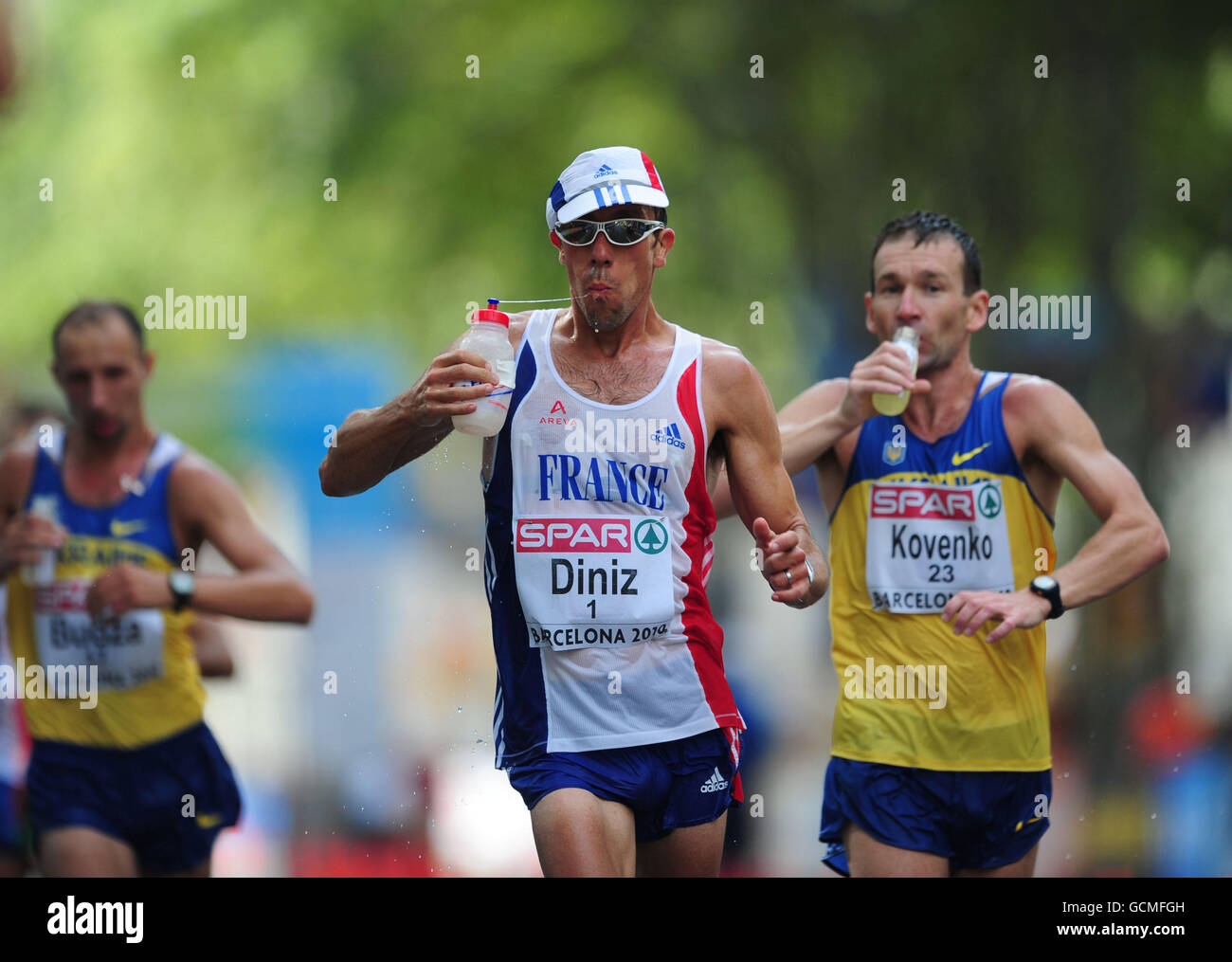 France's Yohann Diniz takes a drink during the Men's 50km Walk Stock Photo