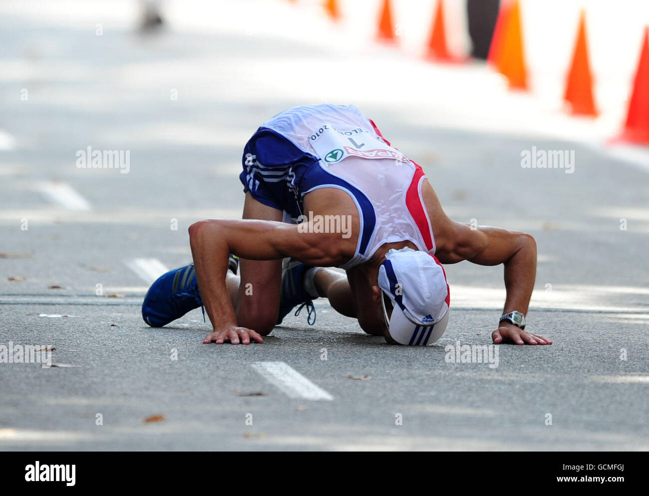 France's Yohann Diniz kisses the ground after winning the Men's 50km Walk Stock Photo